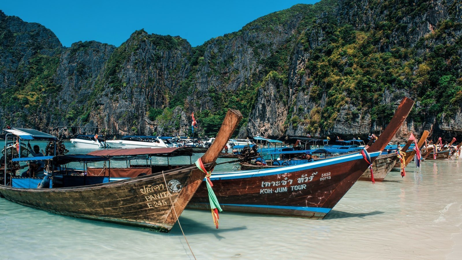 two brown boats in body of water